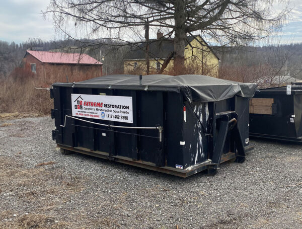 extreme-restoration-pittsburgh-dumpster A roll-off dumpster provided by Extreme Restoration